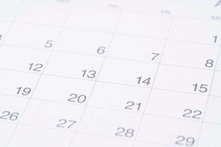 close up of calendar on the table background, planning for business meeting or travel planning concept