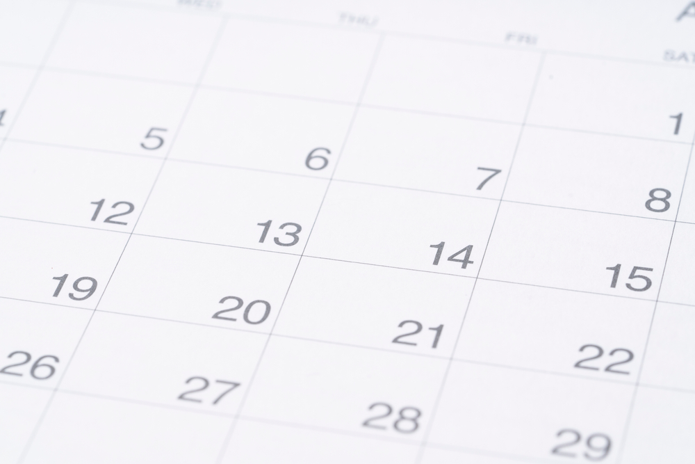 close up of calendar on the table background, planning for business meeting or travel planning concept