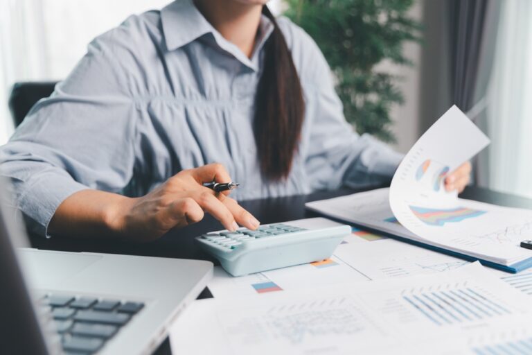 Business woman analyze calculate company financial, tax results office accounting statistics analytical research. calculating business balance prepare tax reduction. Tax deduction planning concept.